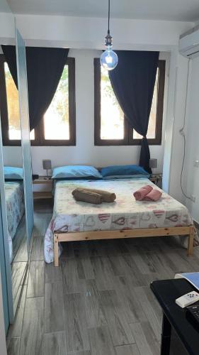 Una cama o camas en una habitación de Perla di Mare