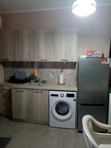 Кухня или мини-кухня в SamolisApartment
