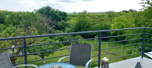 a balcony with a view of the woods at Kuća za odmor Milan in Šarengrad