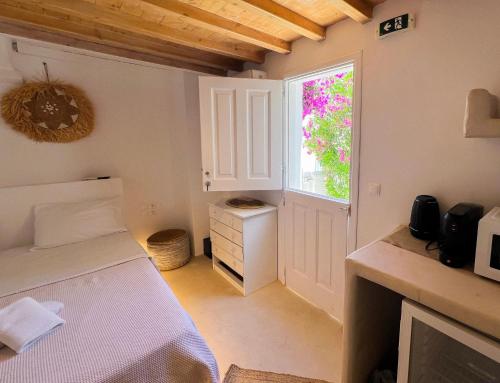 Ένα ή περισσότερα κρεβάτια σε δωμάτιο στο Kamara Residence & Suites