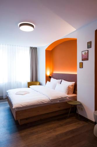 Postel nebo postele na pokoji v ubytování Hotel Sandkorn