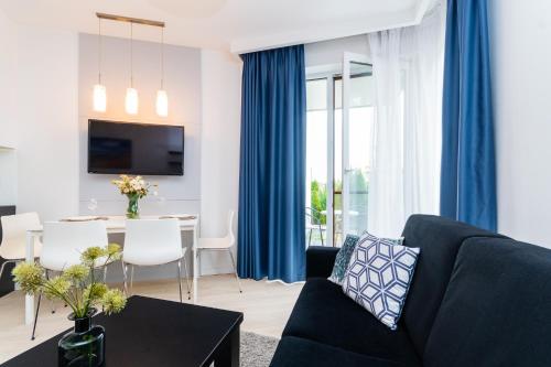 Μια τηλεόραση ή/και κέντρο ψυχαγωγίας στο Flatbook Apartamenty - Kąty Rybackie I