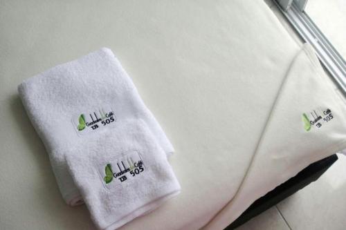 a pair of towels sitting on top of a suitcase at Apartment in Montenegro in Montenegro