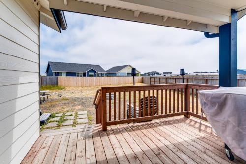 a deck with a view of a house at Hot Tub Modern Ocean Shores Home, 2 Mi to Beach! in Ocean Shores