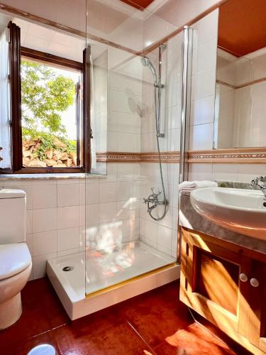 a bathroom with a shower and a sink at Villa Mogro Cueto Hills - Monabri in Mogro