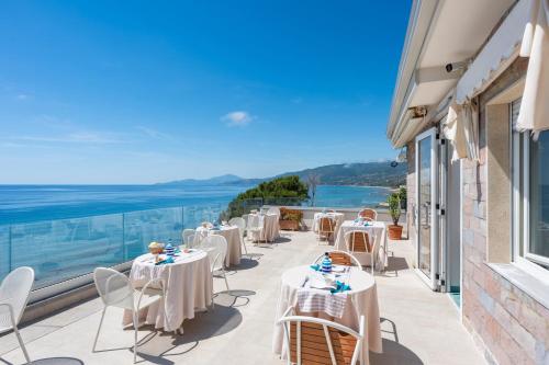 a row of tables on a balcony with a view at B&B Residence Eco Del Mare in Palinuro