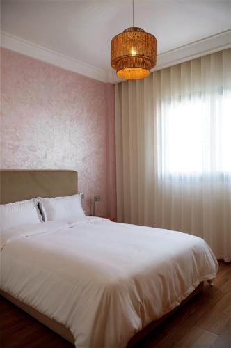 Postel nebo postele na pokoji v ubytování Villa 130 Spacieuse 4 chambres dar bouazza proche plage