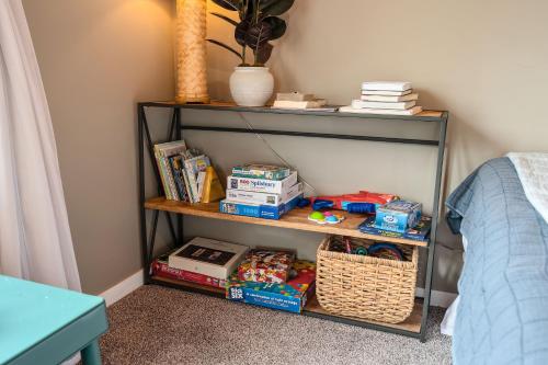 a shelf with food and snacks on it in a bedroom at Serenity Shores 5BD Hot Tub Fishing Hiking in Traverse City