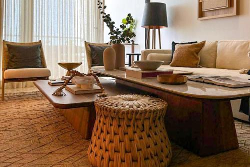 a living room with a couch and a coffee table at Alonisos Luxury Apartment in San Bruno