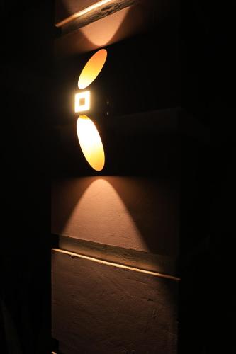 a light on a wall in the dark at AG Home in Kampala