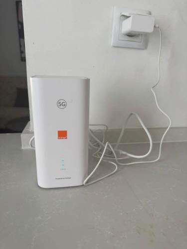 a white wii tower sitting on top of a counter at Appartement a jardin carthage tunis in Sidi Daoud