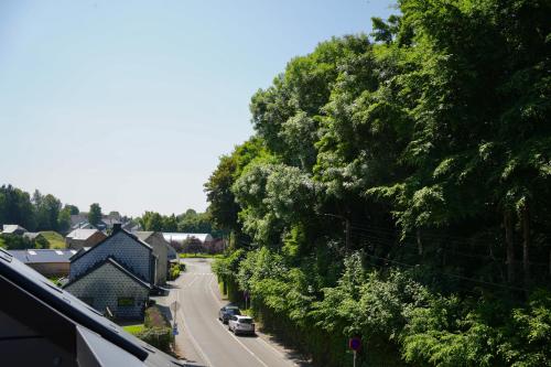 a view of a street with cars driving down a road at Appartement de charme in Vaux-sur-Sûre