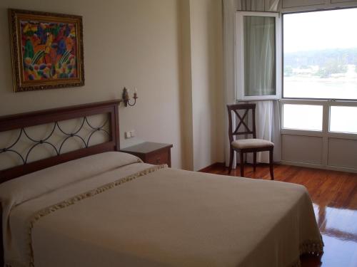 Katil atau katil-katil dalam bilik di Apartamentos Maritimo Suites-Solo Adultos