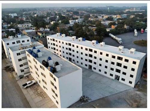 a white building with a view of a city at Blue Beach 2 min to Miramar Beach in Ciudad Madero