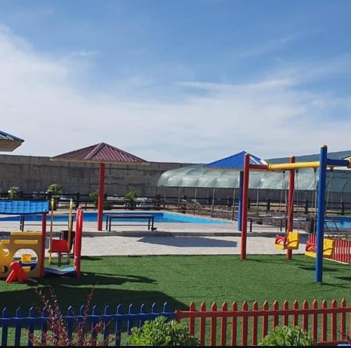 a playground with a slide at Boat Station in Kapchagay