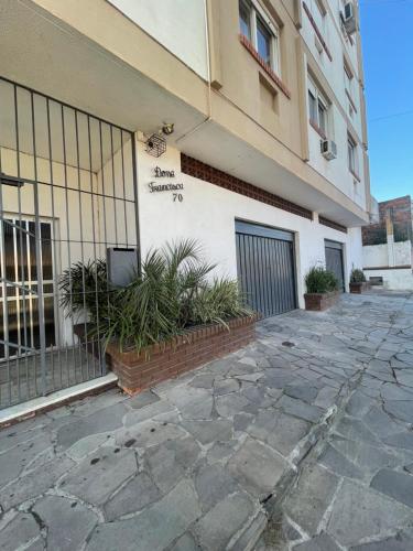 a building with a tv on the side of it at Apartamento amplo in Pelotas