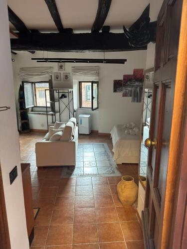 a living room with two couches and a table at Il Nido nel Cimino in Soriano nel Cimino