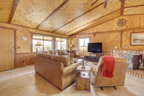 a living room with a couch and chairs in a cabin at Mtn and Golf Course Views Payson Retreat! in Payson