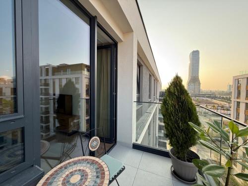 an apartment balcony with a view of a city at BelgradeWATERFRONT - Apartments in Sajmište