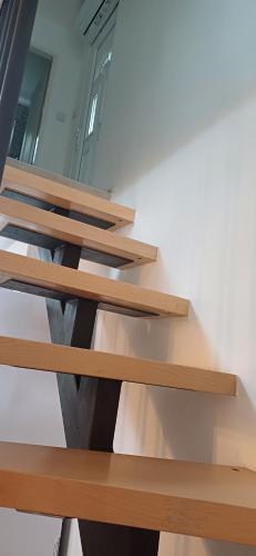 a set of wooden shelves in a room at Gornja mahala in Božići