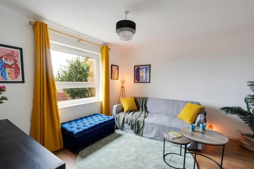 a living room with a couch and a window at Private 3Bed-Parking-Sleeps5-By FabAccommodation in Bristol