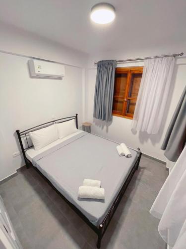 Кровать или кровати в номере Country House, Lagoudi Village