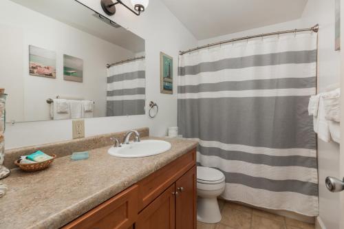 a bathroom with a sink and a toilet at Ocean Terrace Condominiums in Lincoln City