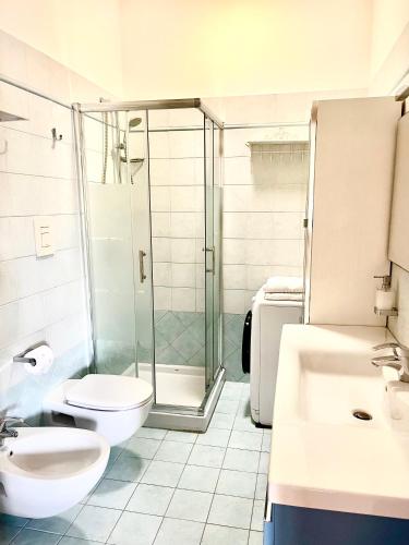 a bathroom with a shower and a toilet and a sink at Polignano Villa with Jacuzzi, Garden & Parking in Polignano a Mare