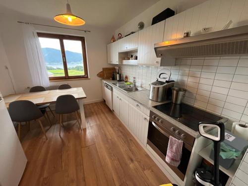 a small kitchen with a table and a counter top at Ferienhaus Moser mit Pool in Nachdemsee