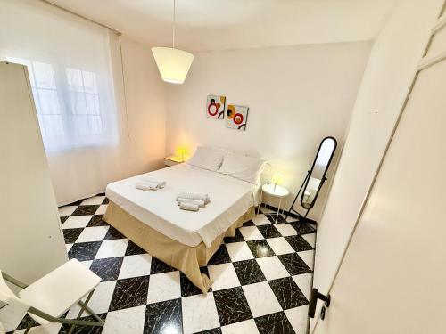 Ένα ή περισσότερα κρεβάτια σε δωμάτιο στο Casa Siry - A pochi passi dalle spiagge di Torre San Giovanni