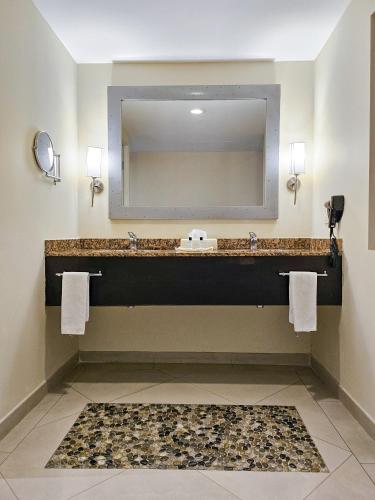 a bathroom with a sink and a large mirror at Casa Francisco in Cuernavaca