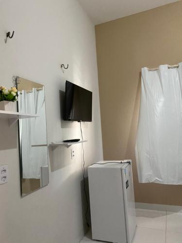 TV a/nebo společenská místnost v ubytování Pousada Dona Dulce