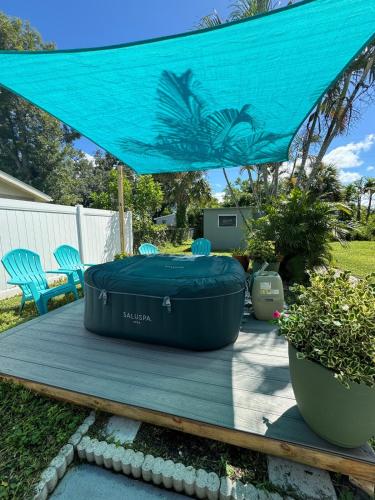 a blue cover on a table in a yard at Beautiful house with jacuzzi near AnnaMariaIsland in Bradenton
