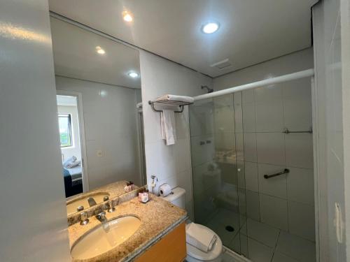 a bathroom with a sink and a shower at Hotel Bienal Ibirapuera UH310 in Sao Paulo