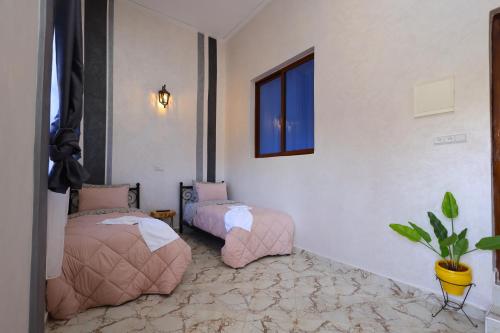 Una cama o camas en una habitación de Palais D'orient