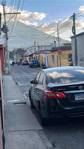 a car parked on the side of a street at Jireh guesthouse in Antigua Guatemala