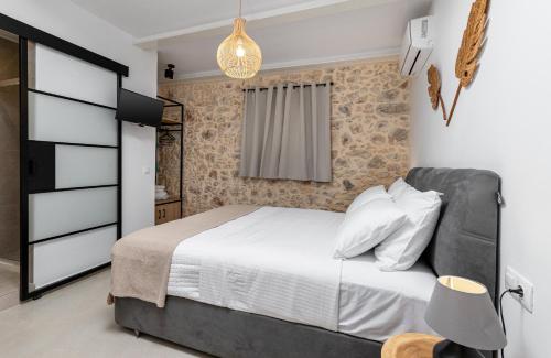 a bedroom with a large bed and a window at Kefalas Luxury Villas Patitiri with Private Pool in Epáno Kefalás
