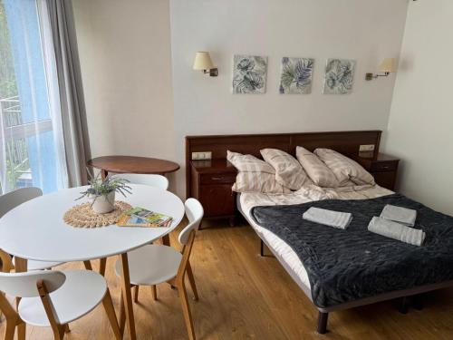 Кровать или кровати в номере Apartament Kołobrzeg Kasprowicza