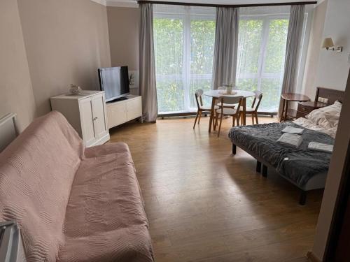 Телевизор и/или развлекательный центр в Apartament Kołobrzeg Kasprowicza
