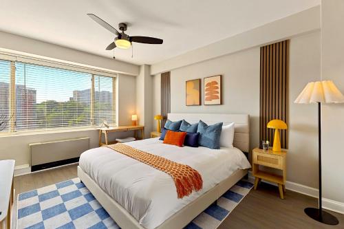a bedroom with a large bed and a window at CASA Arlington Suite with Top-Tier Amenities in Arlington
