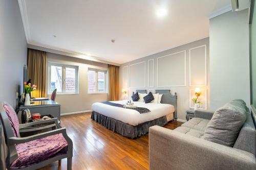 Giường trong phòng chung tại Stellar Boutique Hotel - Near SECC