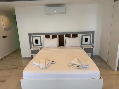 a bedroom with a bed with two towels on it at Stonehillkaş in Kas