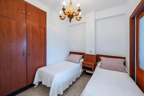 Ένα ή περισσότερα κρεβάτια σε δωμάτιο στο Primera línea de playa en Valdoviño