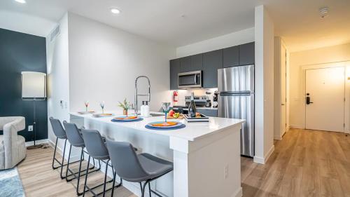 a kitchen with a large white island in a room at The Rambler Inn in Arlington