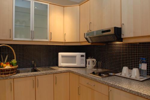 
مطبخ أو مطبخ صغير في Copthorne Al Jahra Hotel & Resort
