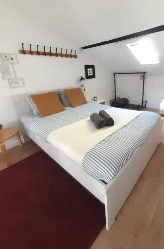 a large white bed sitting in a room at AL Belém 85 in Lisbon