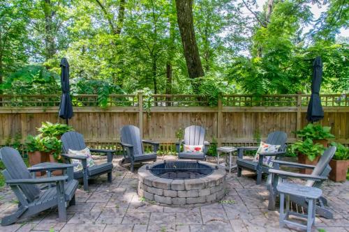 a patio with chairs and a fire pit at Historic 4BR Colonial with Pool Table and Fire Pit in Hendersonville