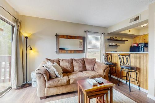 a living room with a couch and a table at Christi Villa 100 in Angel Fire