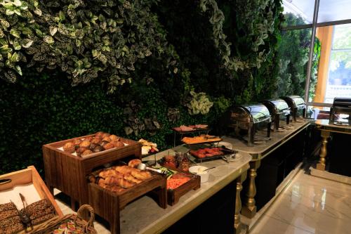 a buffet line with many different types of food at ONOMO Hotel Foreshore in Cape Town