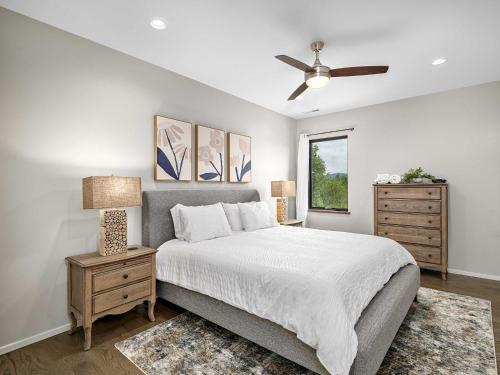 a bedroom with a bed and a ceiling fan at Luxe 5BR with Home Theater, Pool Table and Firepit in Stoney Knob